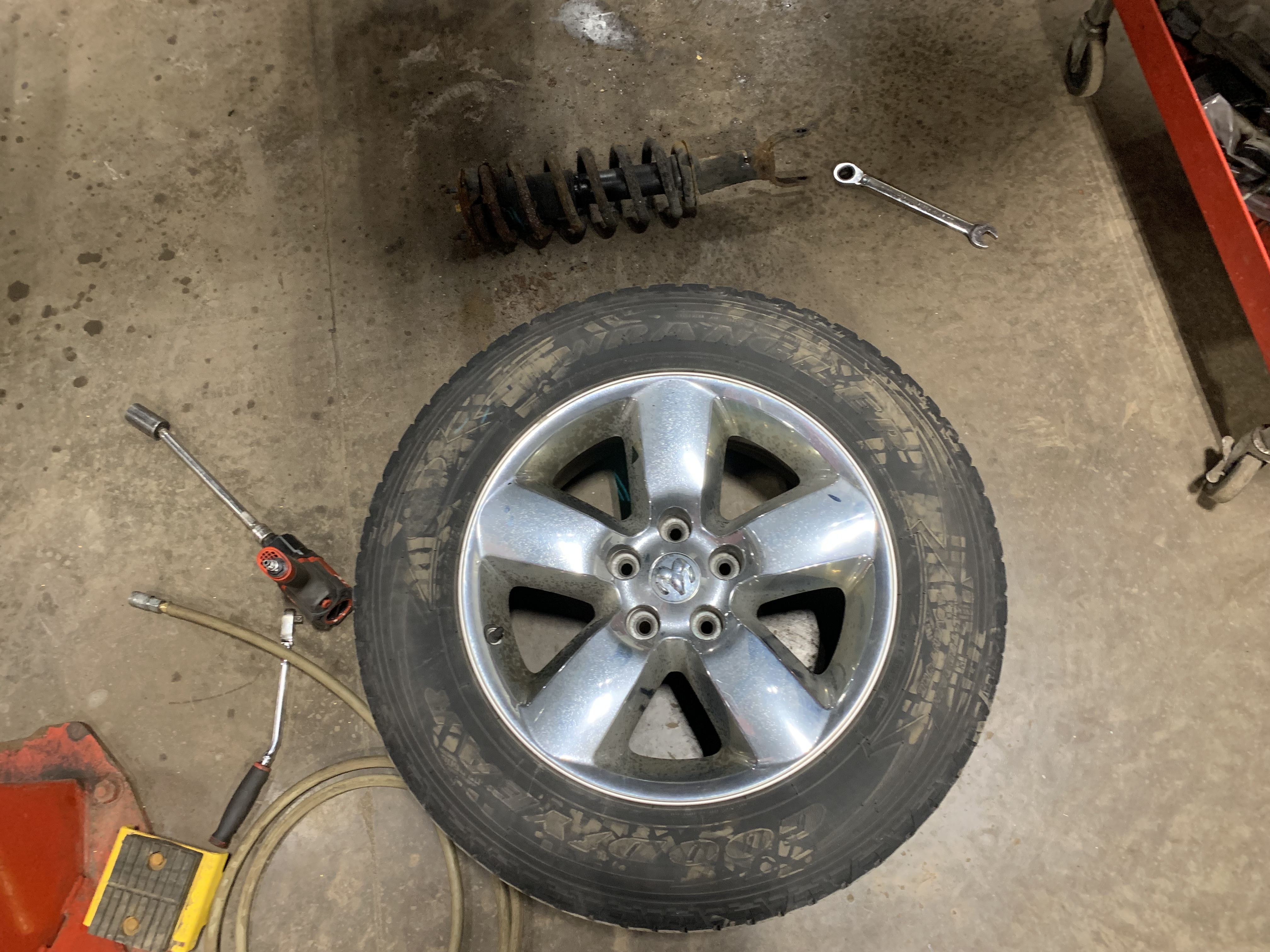 Tire On Shop Floor | Lou's Car Care Center, Inc.